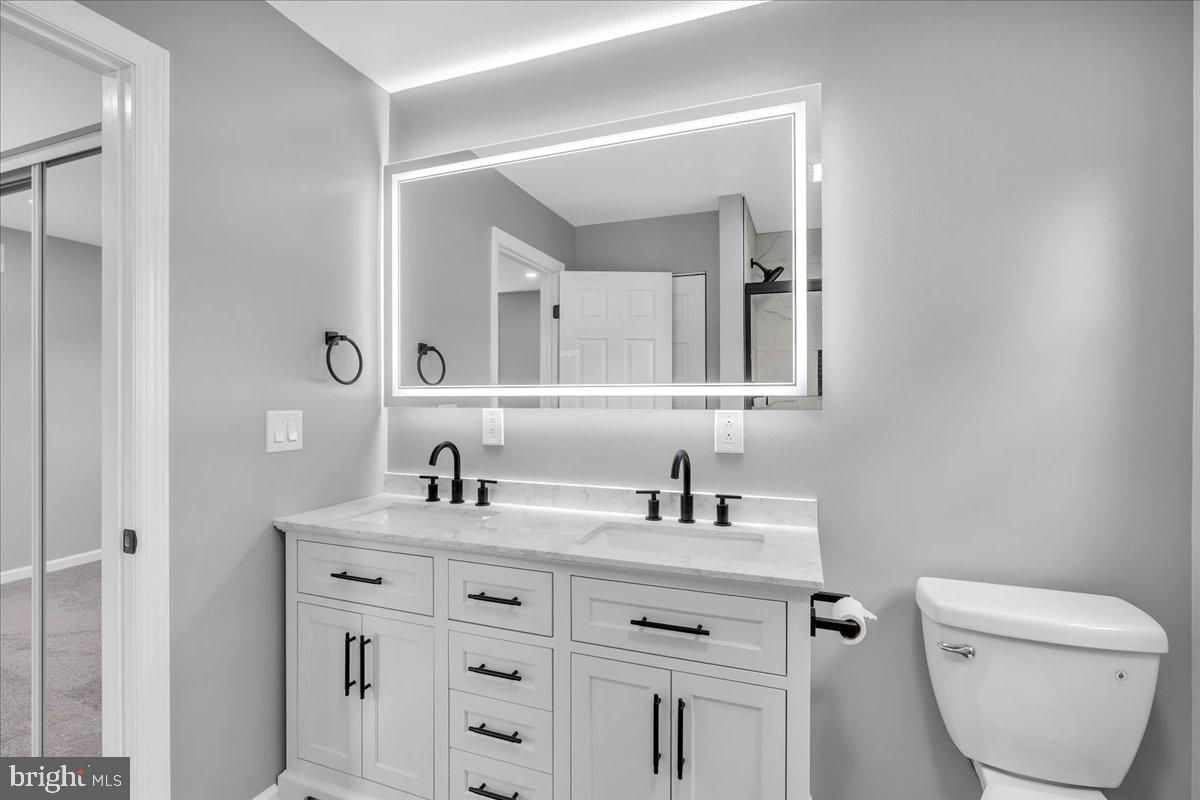147 Country Club Road Pine Hill, NJ 08021 - Photo 40 of 53 a bathroom with a toilet sink and mirror