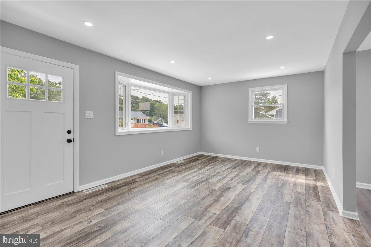 147 Country Club Road Pine Hill, NJ 08021 - Photo 44 of 53 a view of an empty room with wooden floor and a window