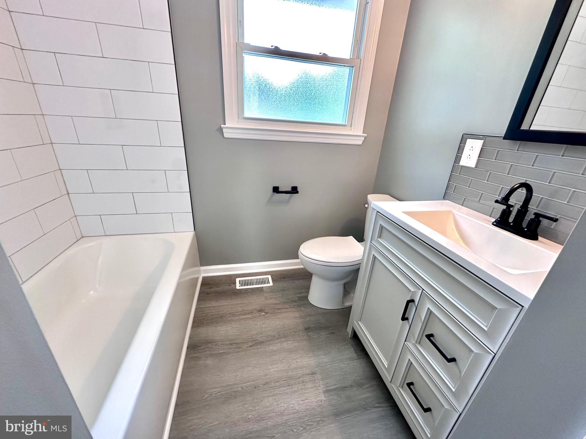 147 Country Club Road Pine Hill, NJ 08021 - Photo 5 of 53 a bathroom with a sink and a bathtub