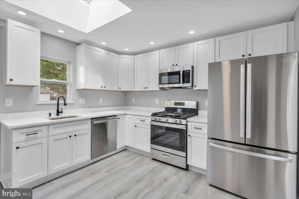 147 Country Club Road Pine Hill, NJ 08021 - Photo 53 of 53 a kitchen with stainless steel appliances a refrigerator sink and microwave