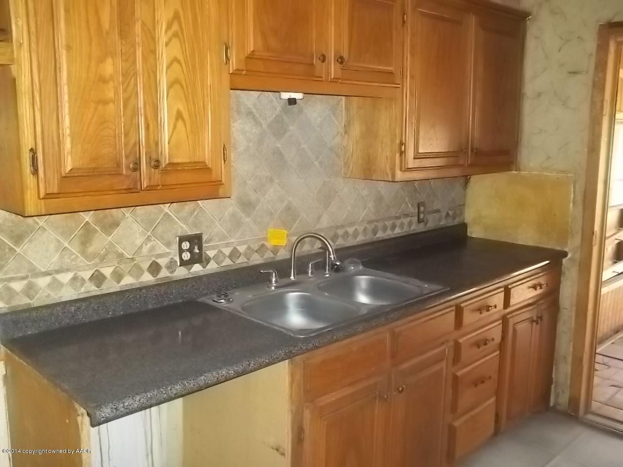 5104 Arden Road Amarillo, TX 79110 - Photo 2 of 9 a close view of sink and tap