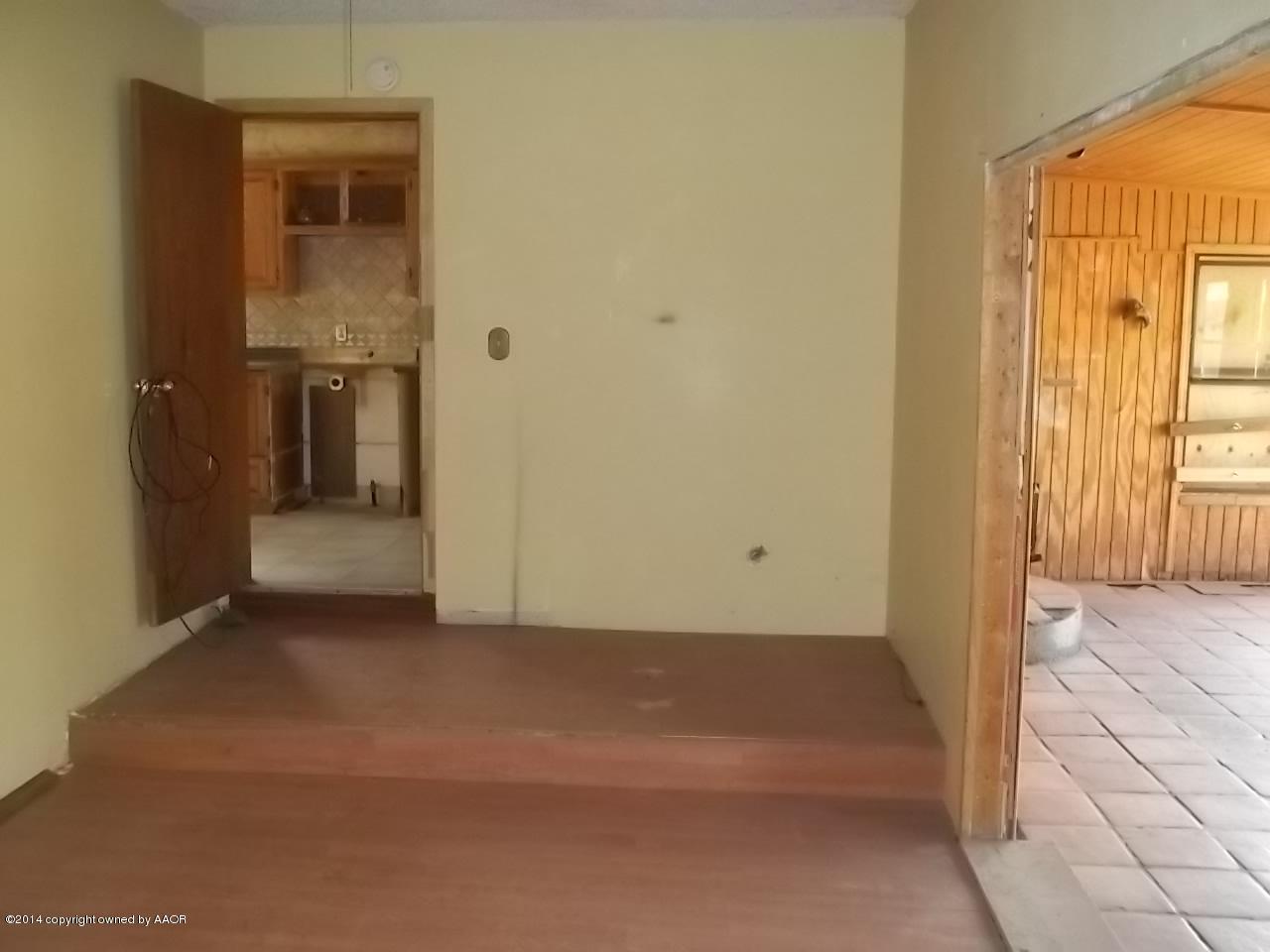 5104 Arden Road Amarillo, TX 79110 - Photo 5 of 9 an empty room with windows