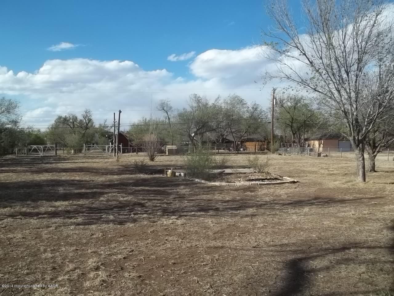 5104 Arden Road Amarillo, TX 79110 - Photo 8 of 9 a view of dirt yard with large trees