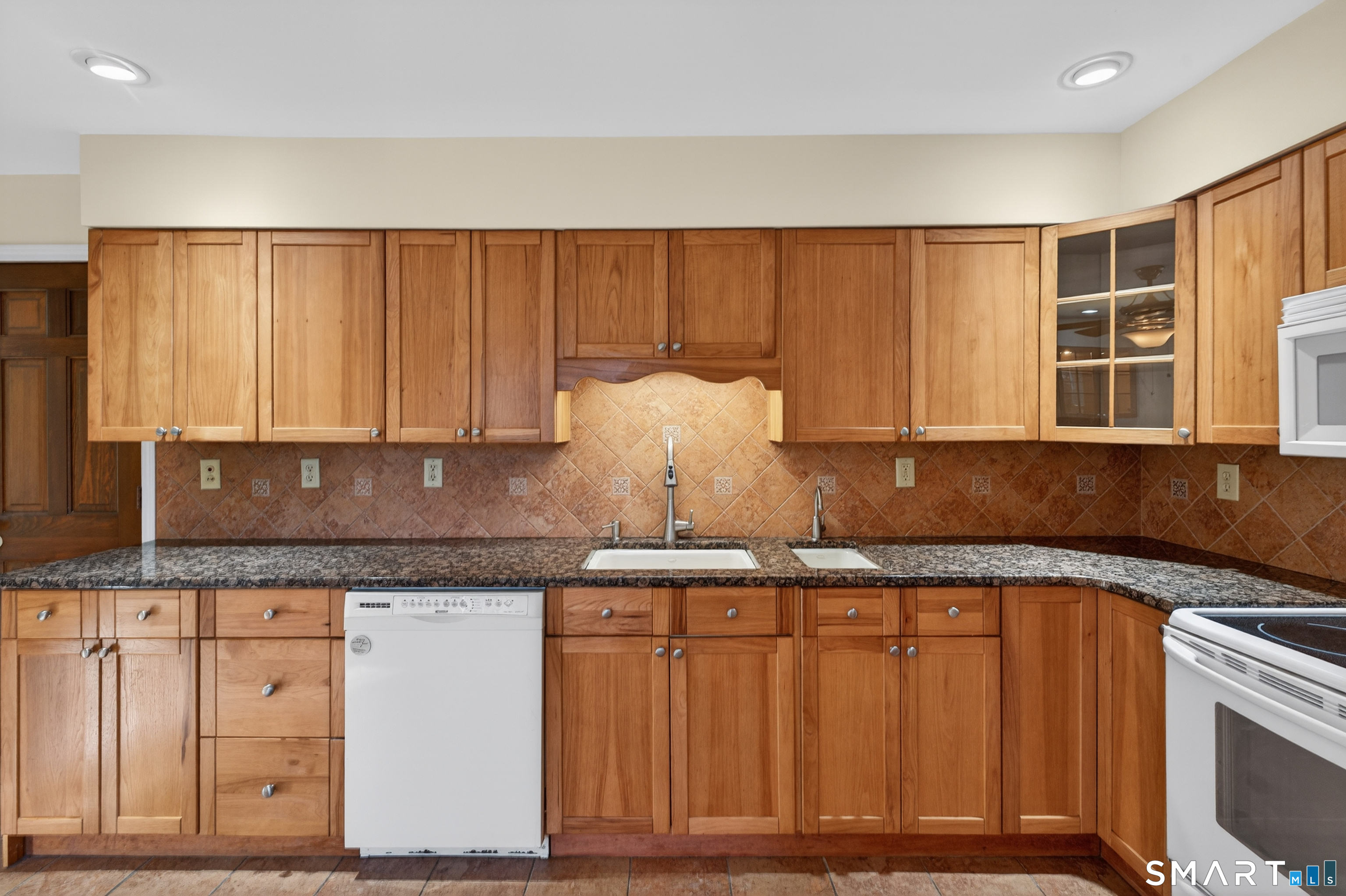 29 Legendary Road East Lyme, CT 06333 - Photo 13 of 36 a kitchen with granite countertop cabinets sink and stainless steel appliances