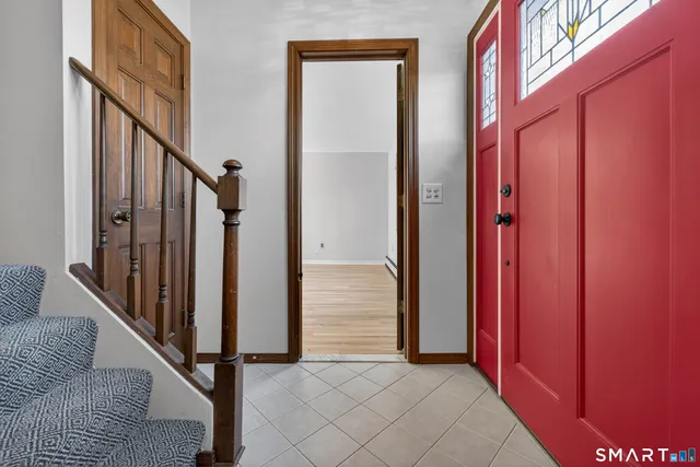 a view of a livingroom with furniture and stairs