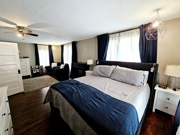 a bed room with bed and window