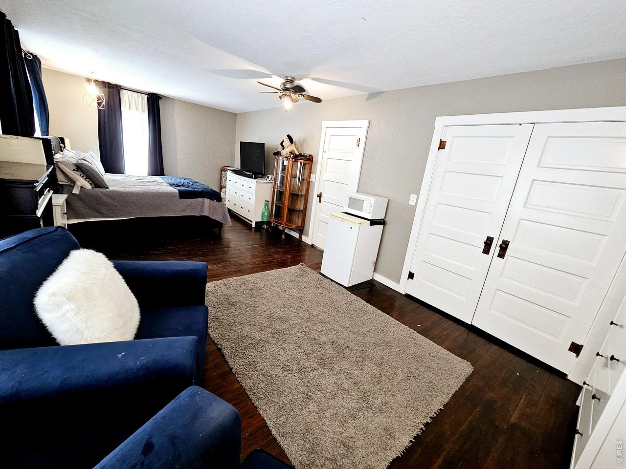 704 South 3rd Avenue Sterling, CO 80751 - Photo 21 of 33 Primary bedroom suite with walk-in closet behind double doors