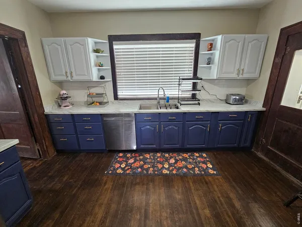 a kitchen with wooden cabinets and a sink