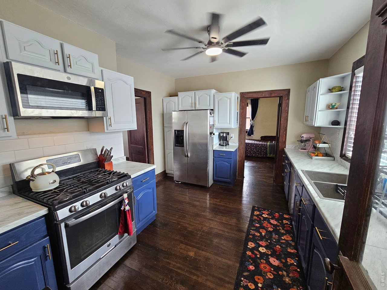 704 South 3rd Avenue Sterling, CO 80751 - Photo 10 of 33 Modernized kitchen with new cabinets and countertops and refinished floors