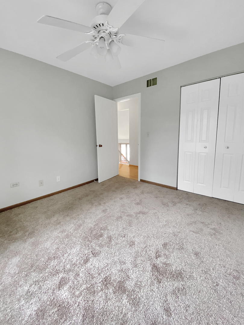 2080 Savannah Road Elgin, IL 60123 - Photo 12 of 17 a view of an empty room and chandelier fan