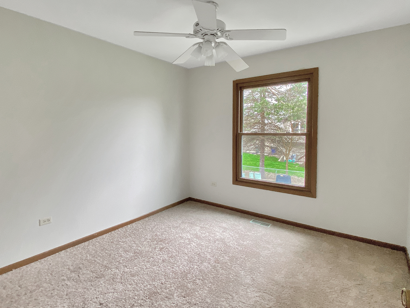 2080 Savannah Road Elgin, IL 60123 - Photo 17 of 17 an empty room with windows and ceiling fan