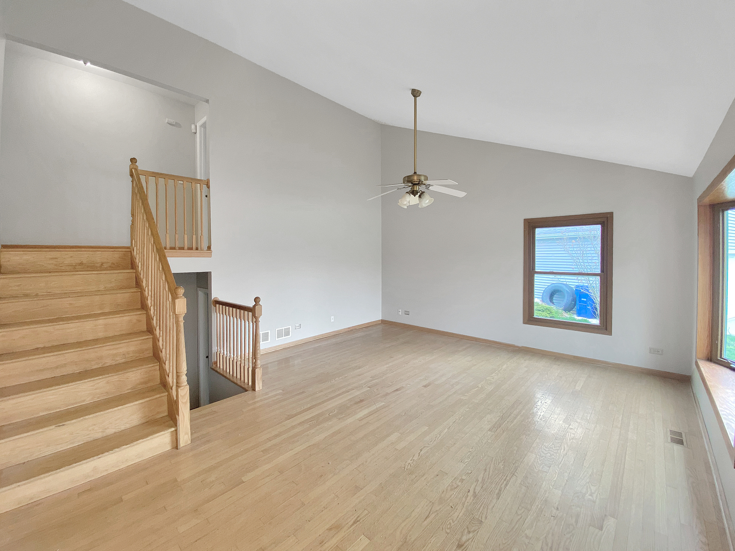2080 Savannah Road Elgin, IL 60123 - Photo 2 of 17 wooden floor in an empty room with a window