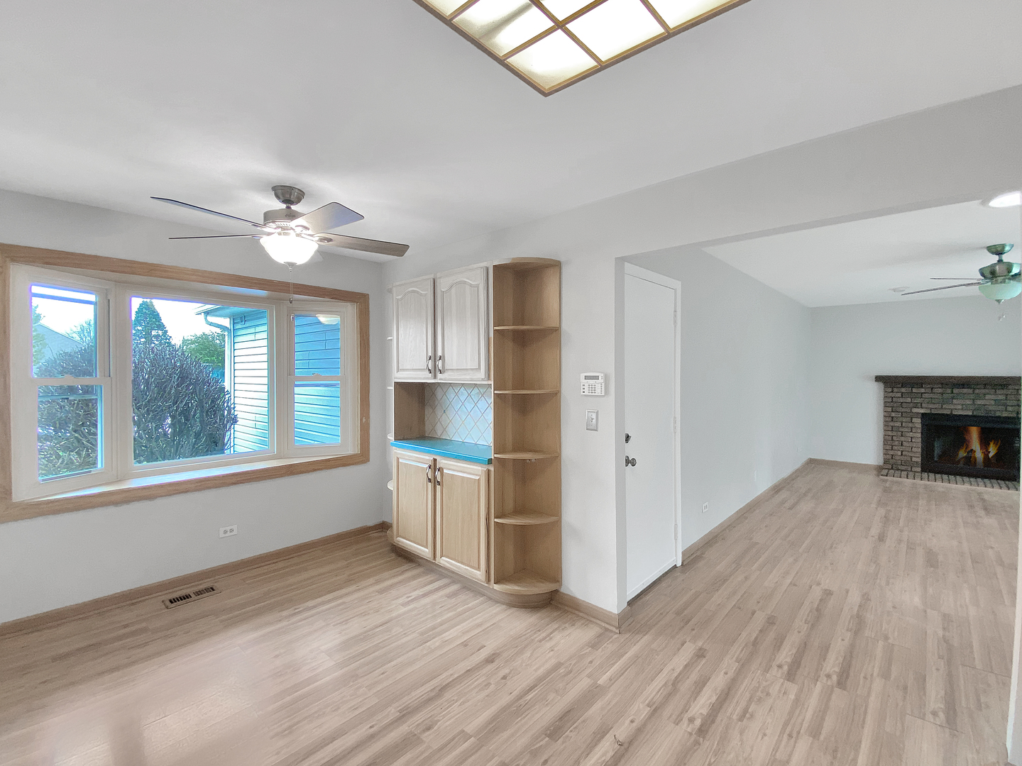 2080 Savannah Road Elgin, IL 60123 - Photo 6 of 17 a view of empty room with wooden floor and fan