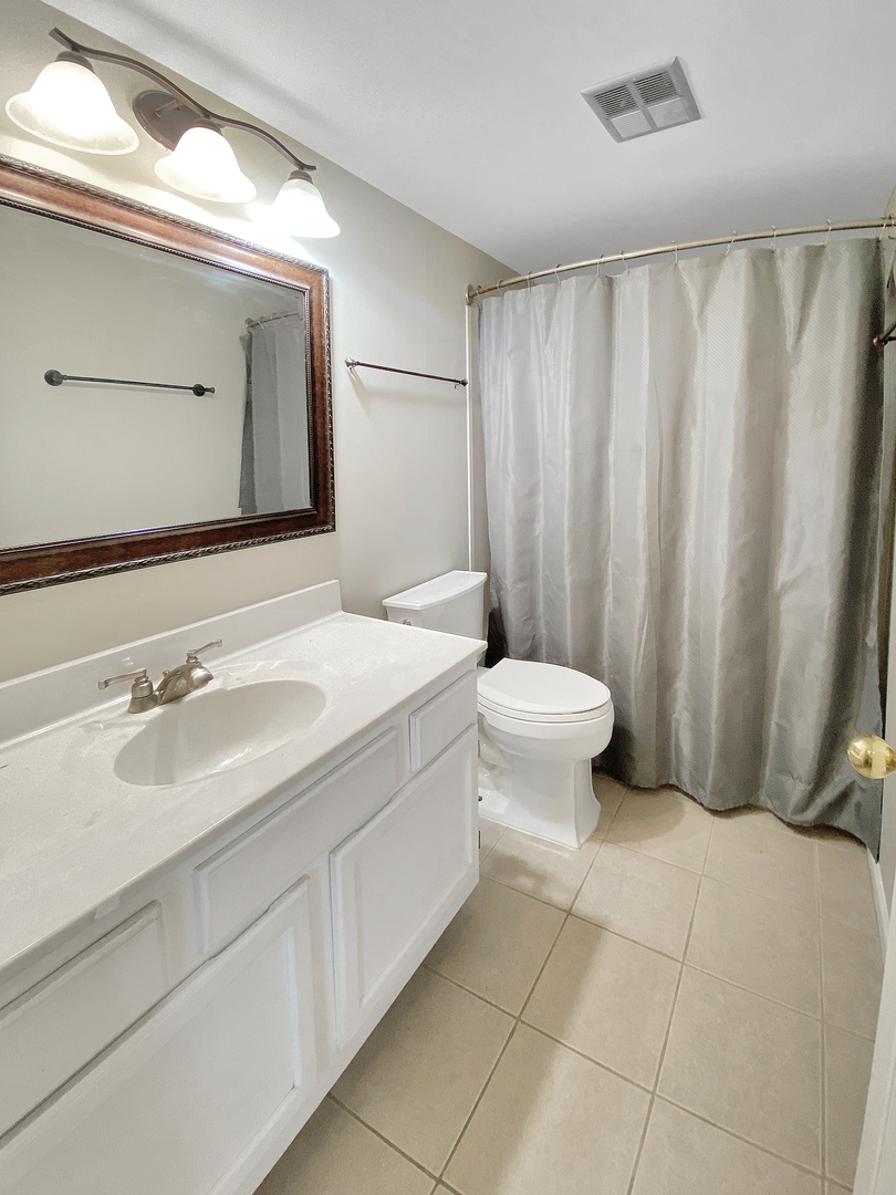 2080 Savannah Road Elgin, IL 60123 - Photo 8 of 17 a bathroom with a sink and a mirror