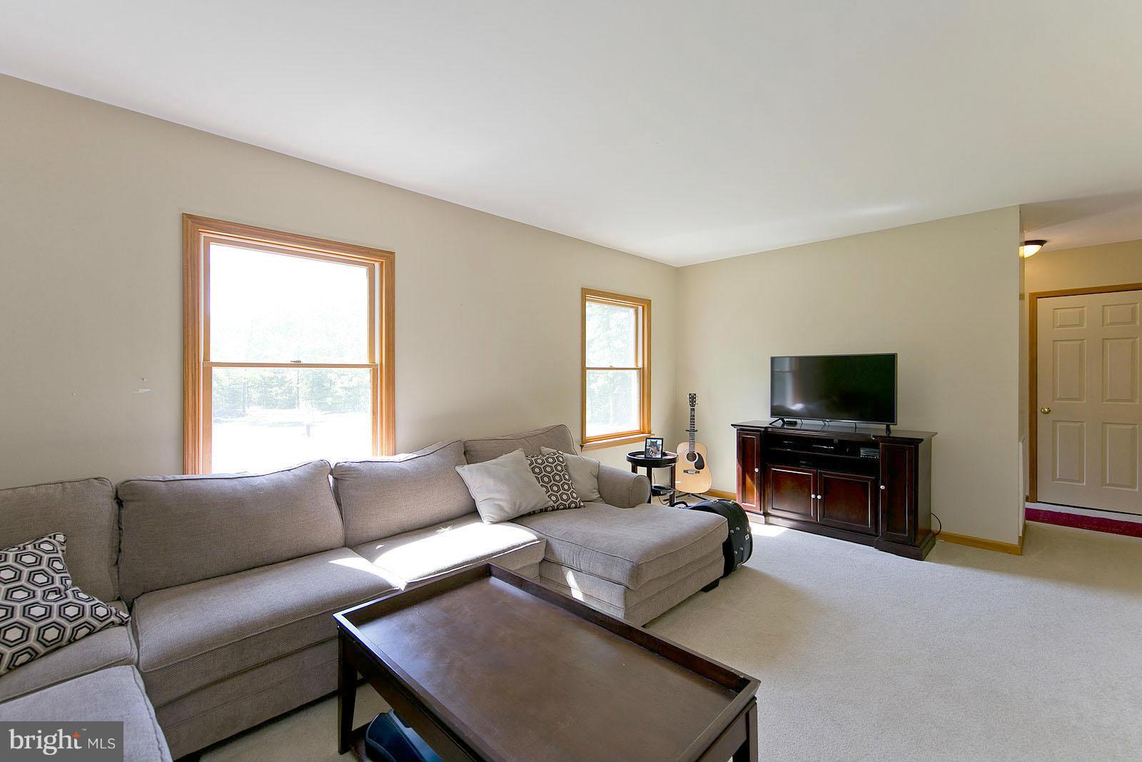 2000 South Pifer Road Star Tannery, VA 22654 - Photo 2 of 12 a living room with furniture and a flat screen tv