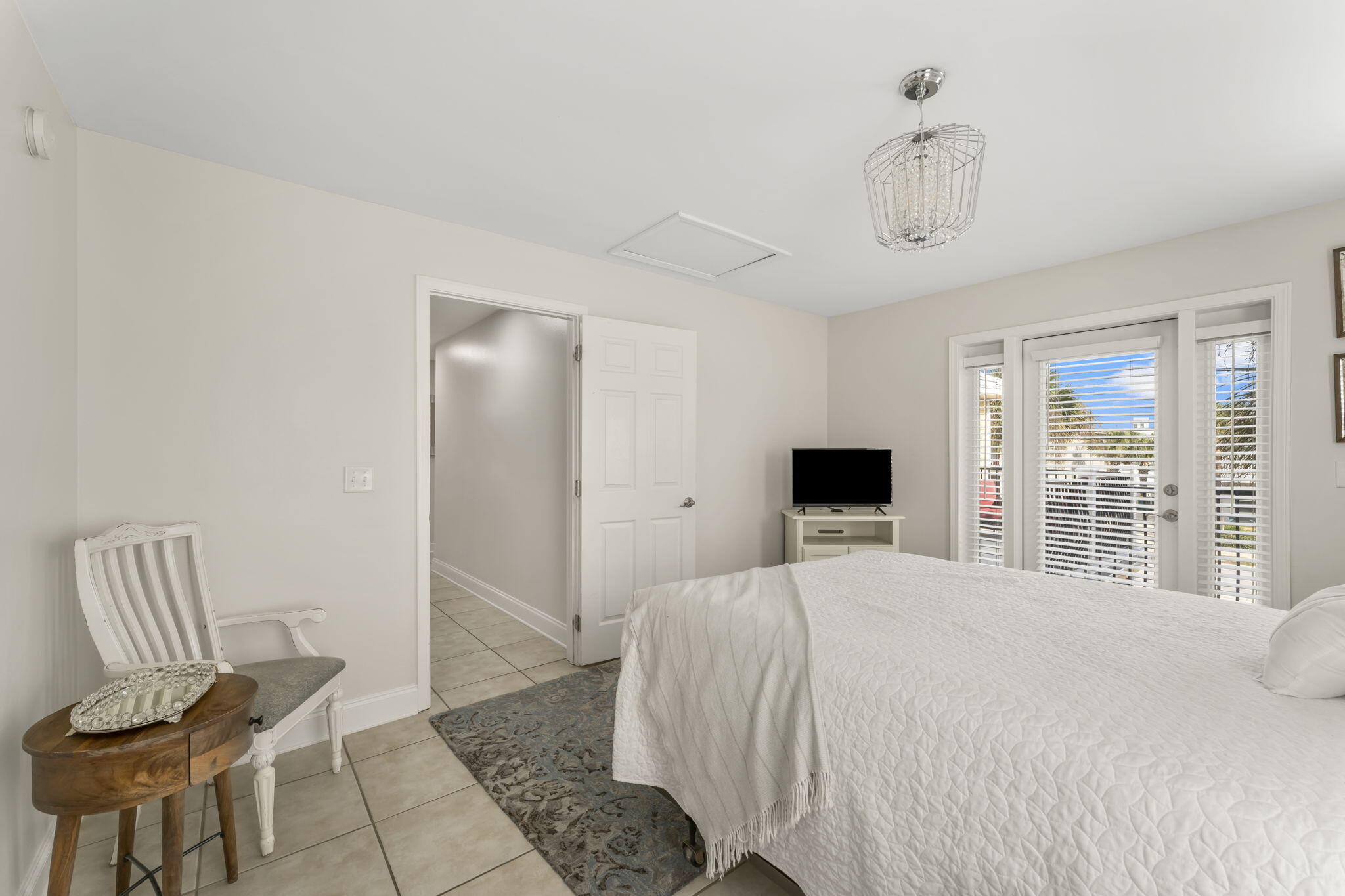 80 Shirah Street Destin, FL 32541 - Photo 34 of 66 a bedroom with a bed and chair