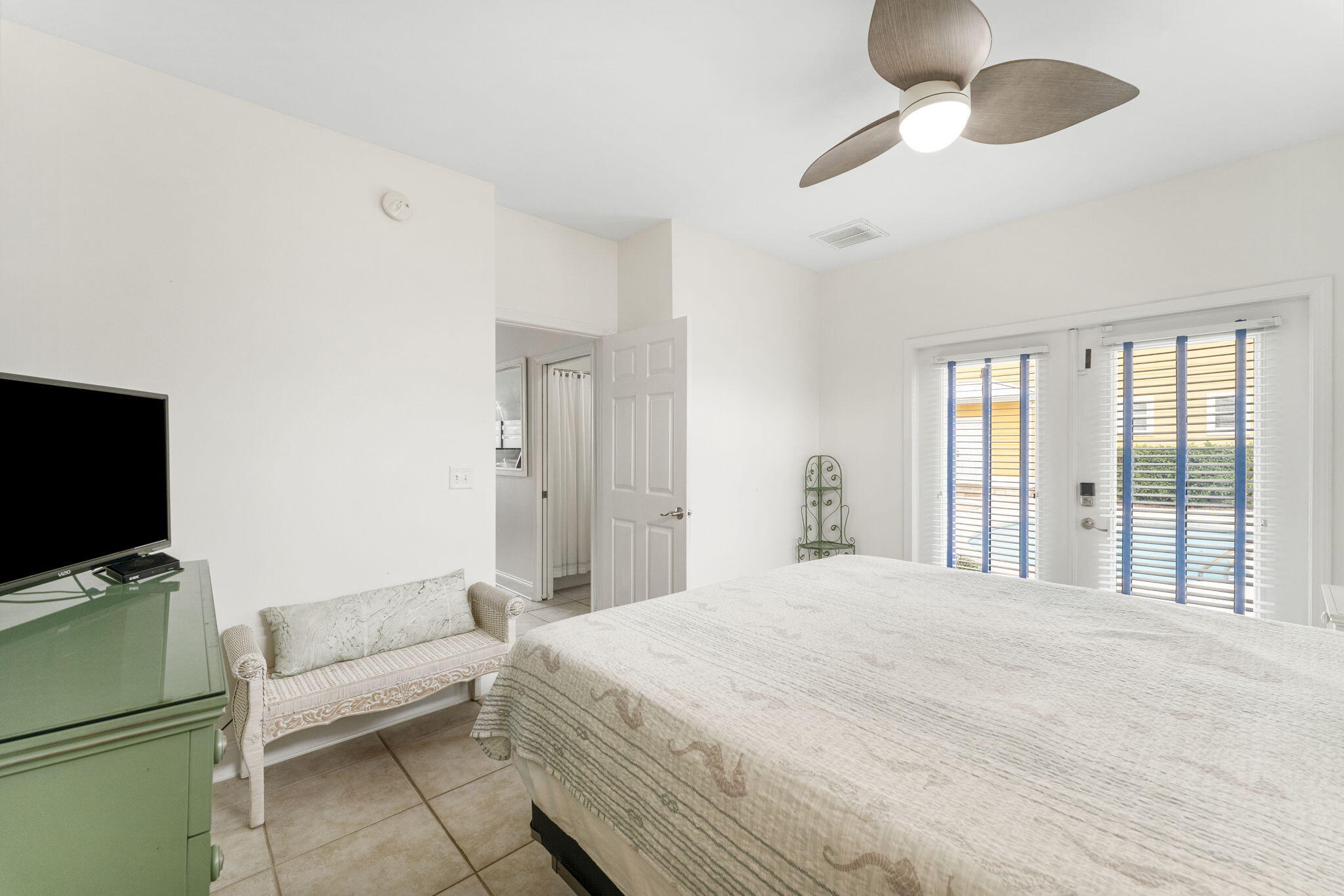 80 Shirah Street Destin, FL 32541 - Photo 54 of 66 a bedroom with a bed and a flat screen tv