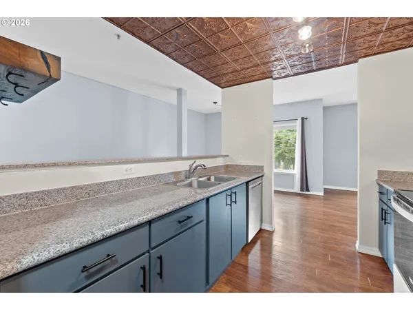 a kitchen with a sink and cabinets