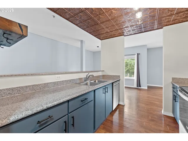 a kitchen with a sink and cabinets