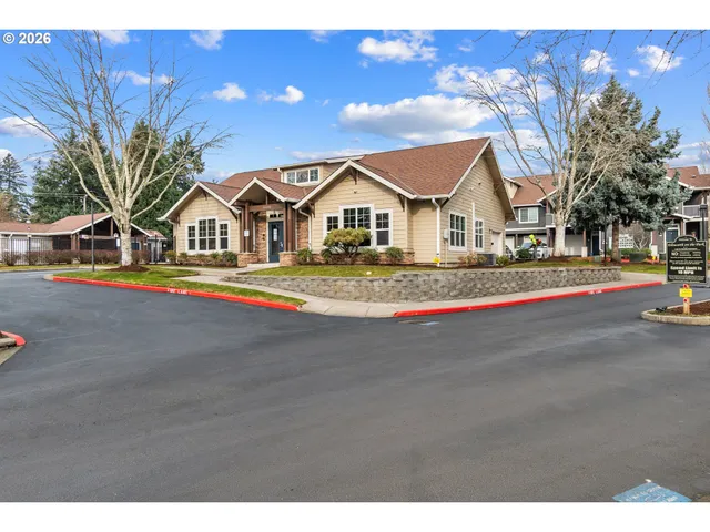 a front view of a house with a street
