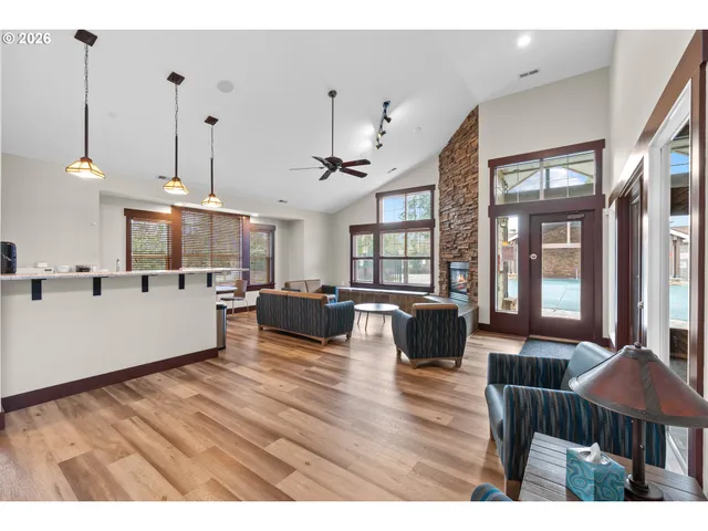 a living room with furniture window and wooden floor