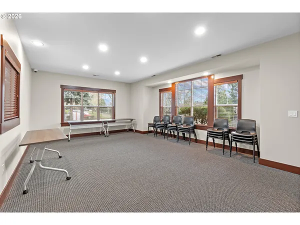 a room with furniture and a large window