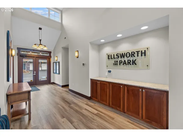 a view of hallway with wooden floor