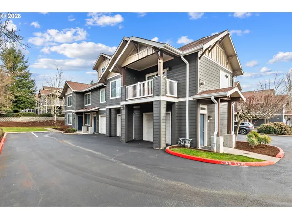 a view of a house with pool and a yard