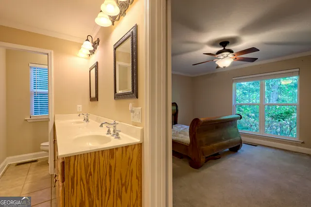 a view of utility room and bedroom