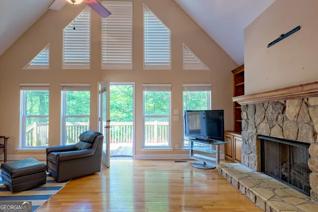 a backyard of a house with lots of green space and plants