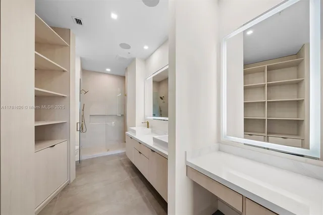 a bathroom with a double vanity sink and a bathtub