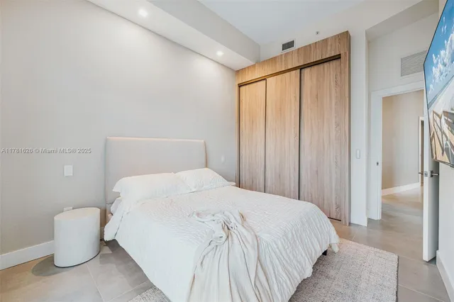a view of balcony with two chairs and a potted plant