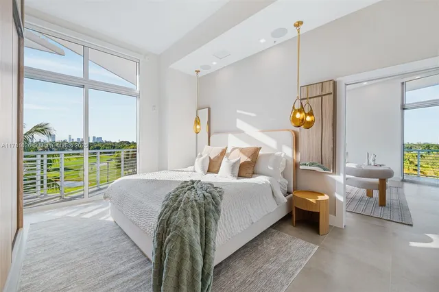 a bed room with a bed and a large window