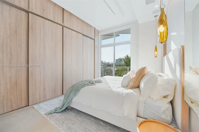 a bedroom with bed and a window