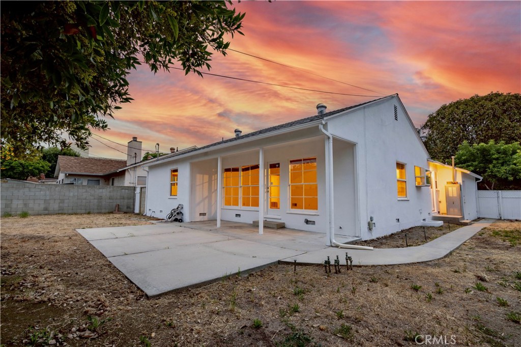 8129 Darby Place Reseda, CA 91335 - Photo 15 of 19 a front view of a house with a yard