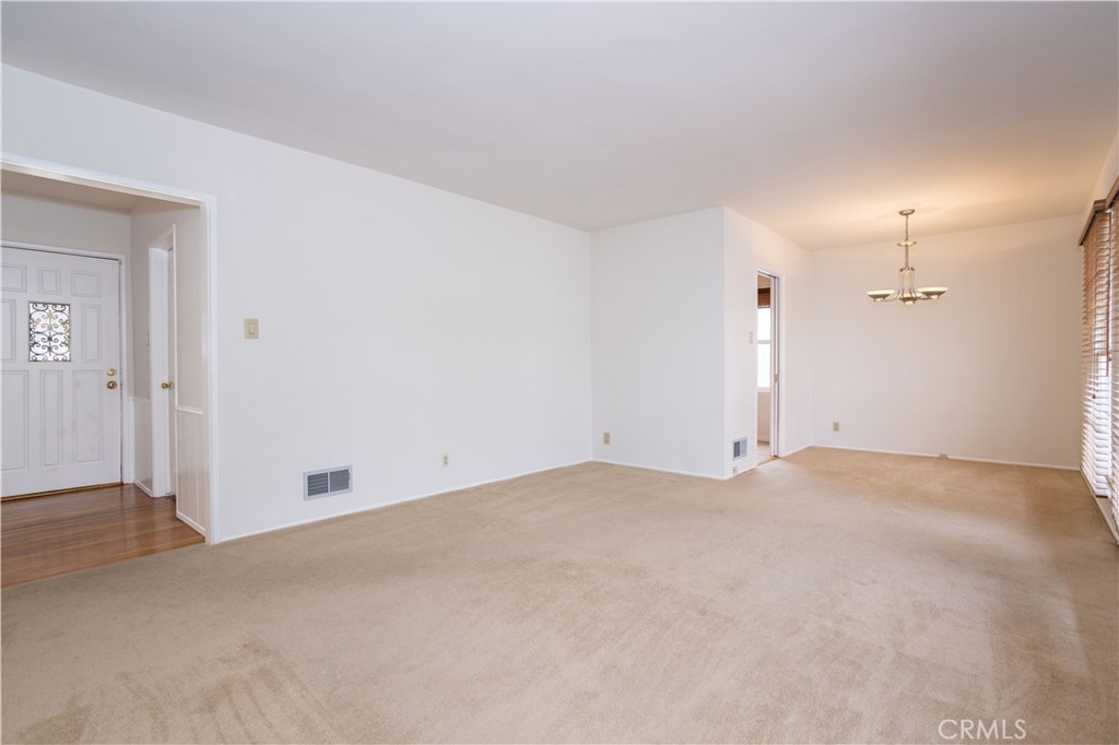 8129 Darby Place Reseda, CA 91335 - Photo 6 of 19 an empty room with closet and windows
