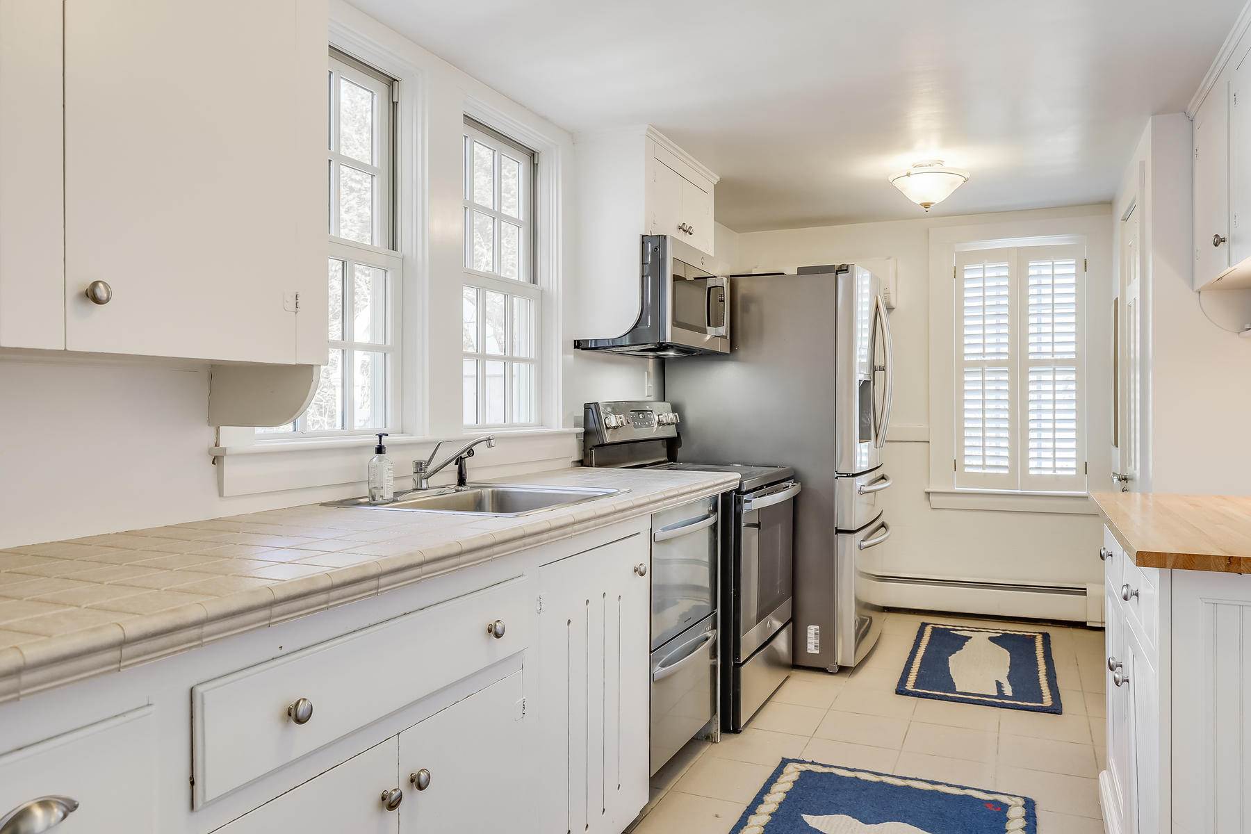 31 Parker Road Osterville, MA 02655 - Photo 8 of 24 a kitchen with a sink appliances cabinets and a window
