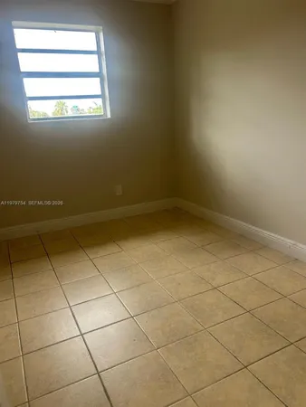a view of a room that has a window in it