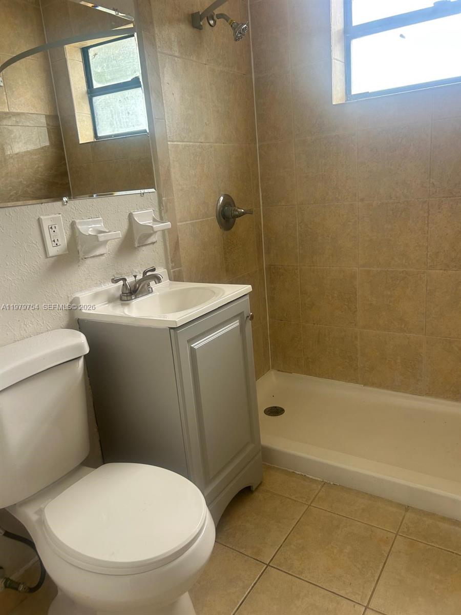 28511 Southwest 147th Avenue Homestead, FL 33033 - Photo 14 of 19 a bathroom with a sink a toilet and shower