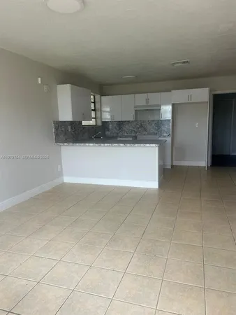 a kitchen with a sink cabinets and counter space