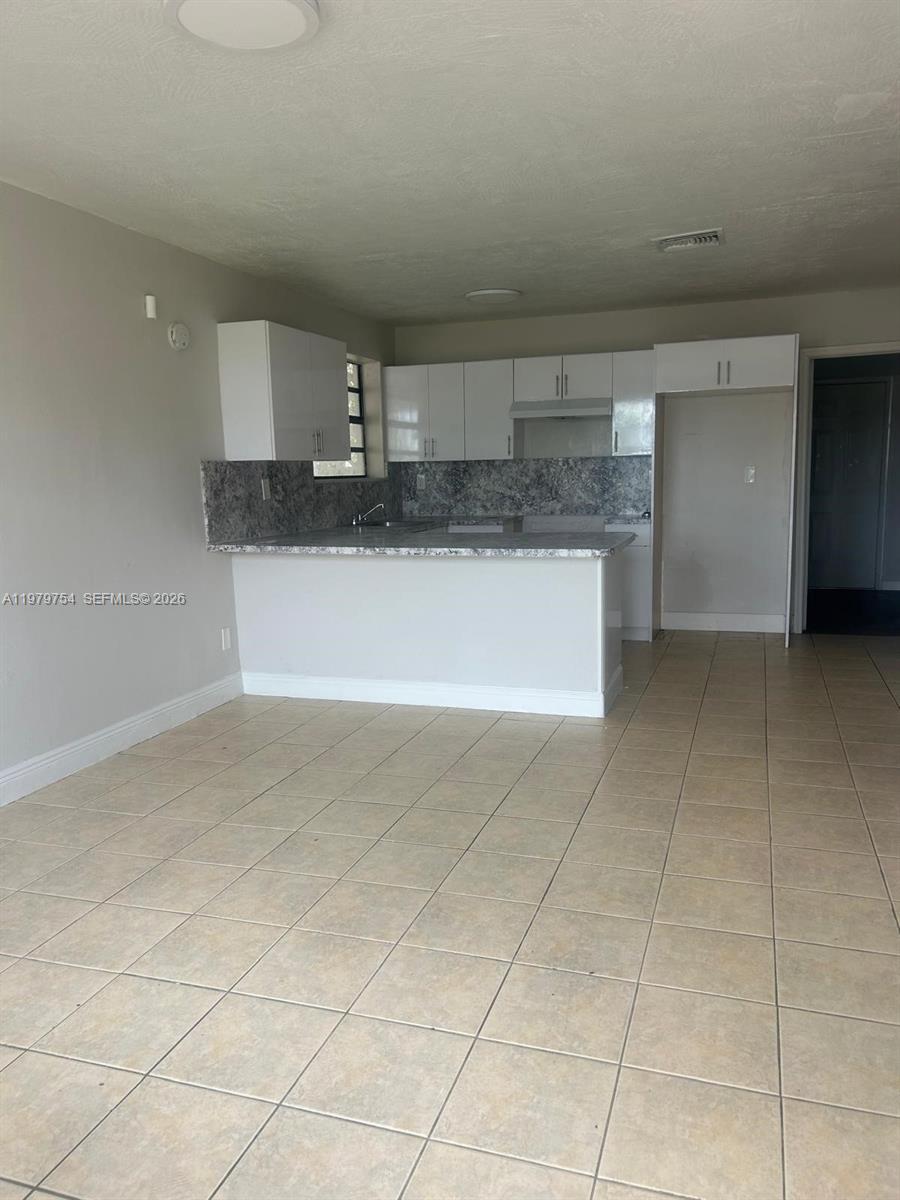 28511 Southwest 147th Avenue Homestead, FL 33033 - Photo 8 of 19 a kitchen with a sink cabinets and counter space