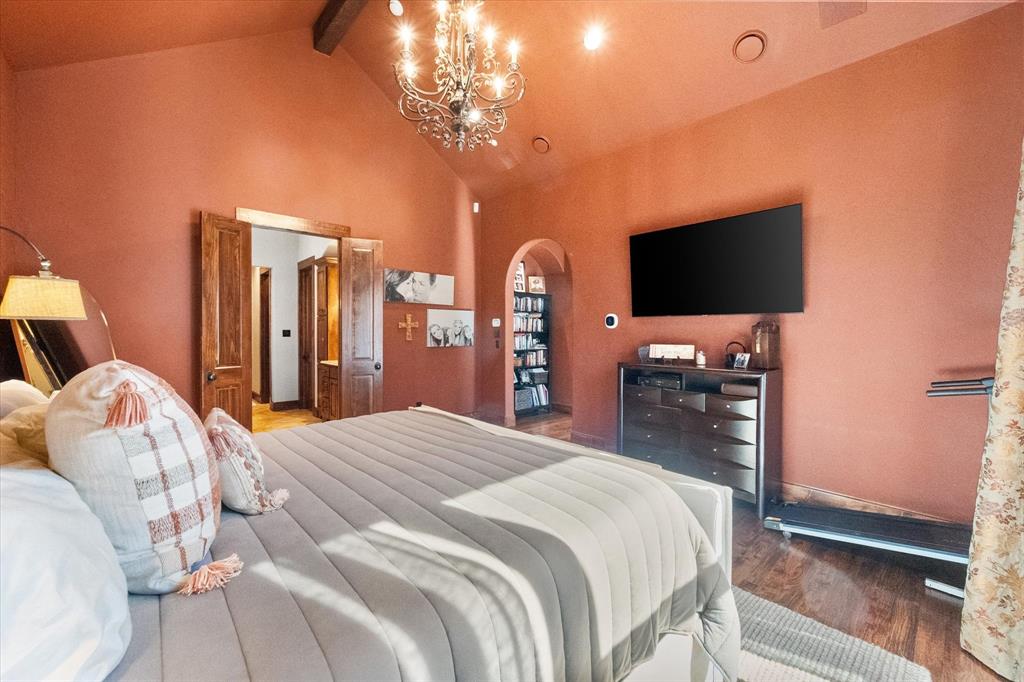 920 Nottingham Road Keller, TX 76248 - Photo 23 of 38 a bedroom with a bed and a flat screen tv