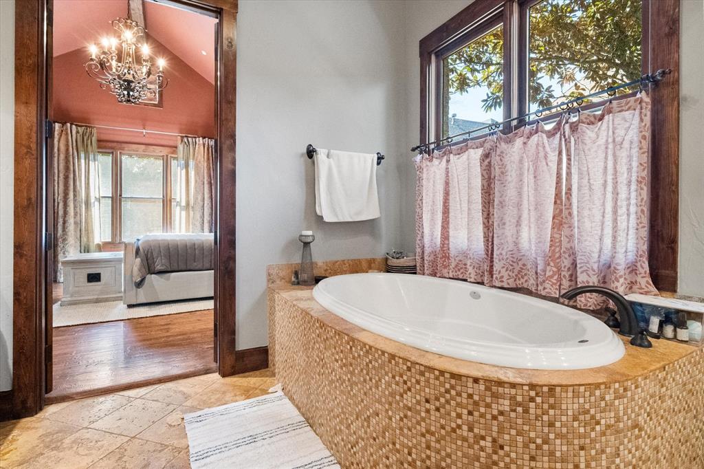 920 Nottingham Road Keller, TX 76248 - Photo 26 of 38 a bathroom with a tub a sink and a window
