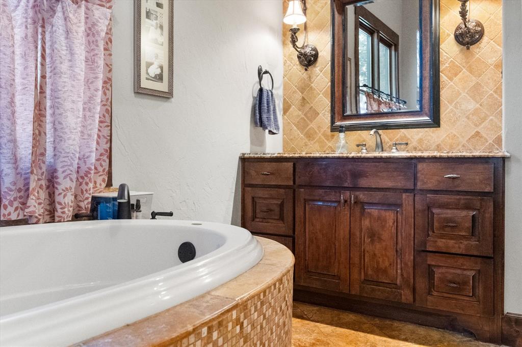 920 Nottingham Road Keller, TX 76248 - Photo 27 of 38 a bathroom with a sink and a mirror