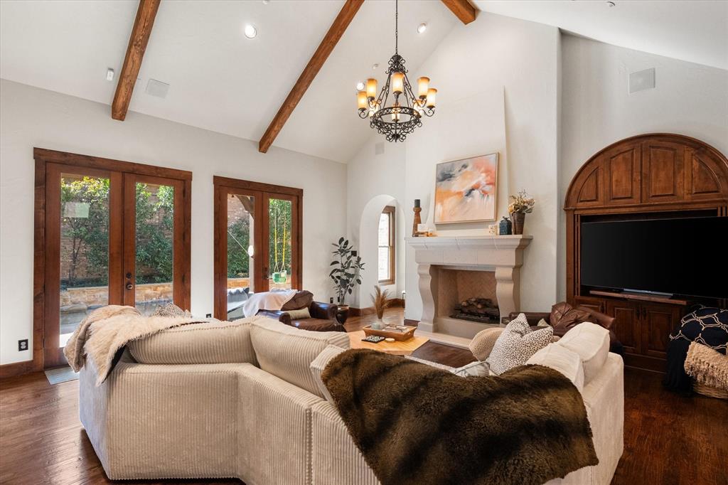 920 Nottingham Road Keller, TX 76248 - Photo 8 of 38 a living room with furniture a fireplace and a chandelier