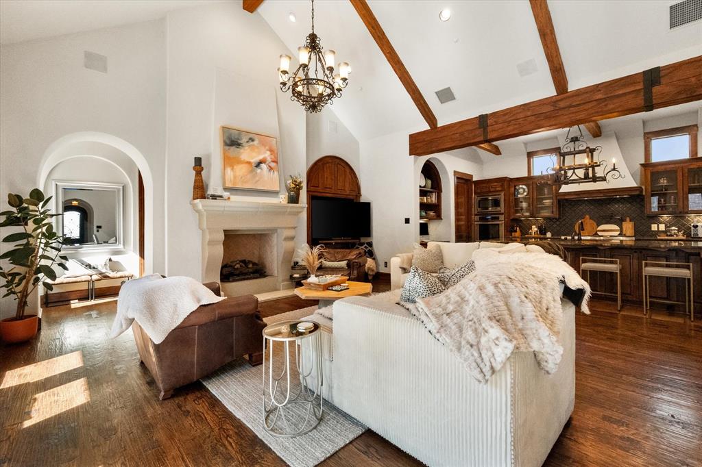 920 Nottingham Road Keller, TX 76248 - Photo 9 of 38 a living room with fireplace furniture and a chandelier