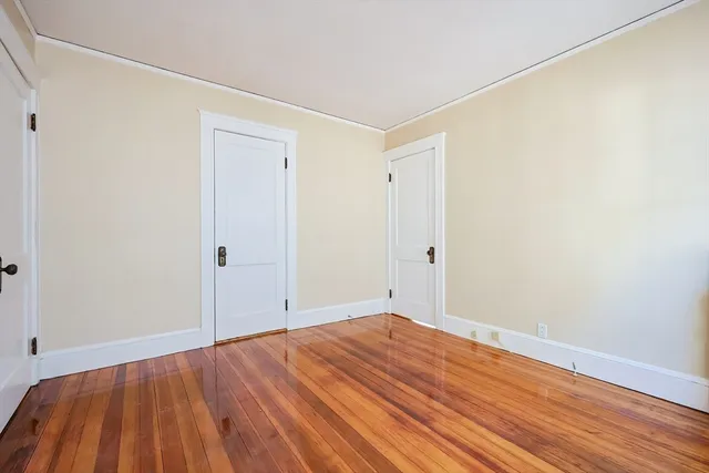 a view of room with wooden floor