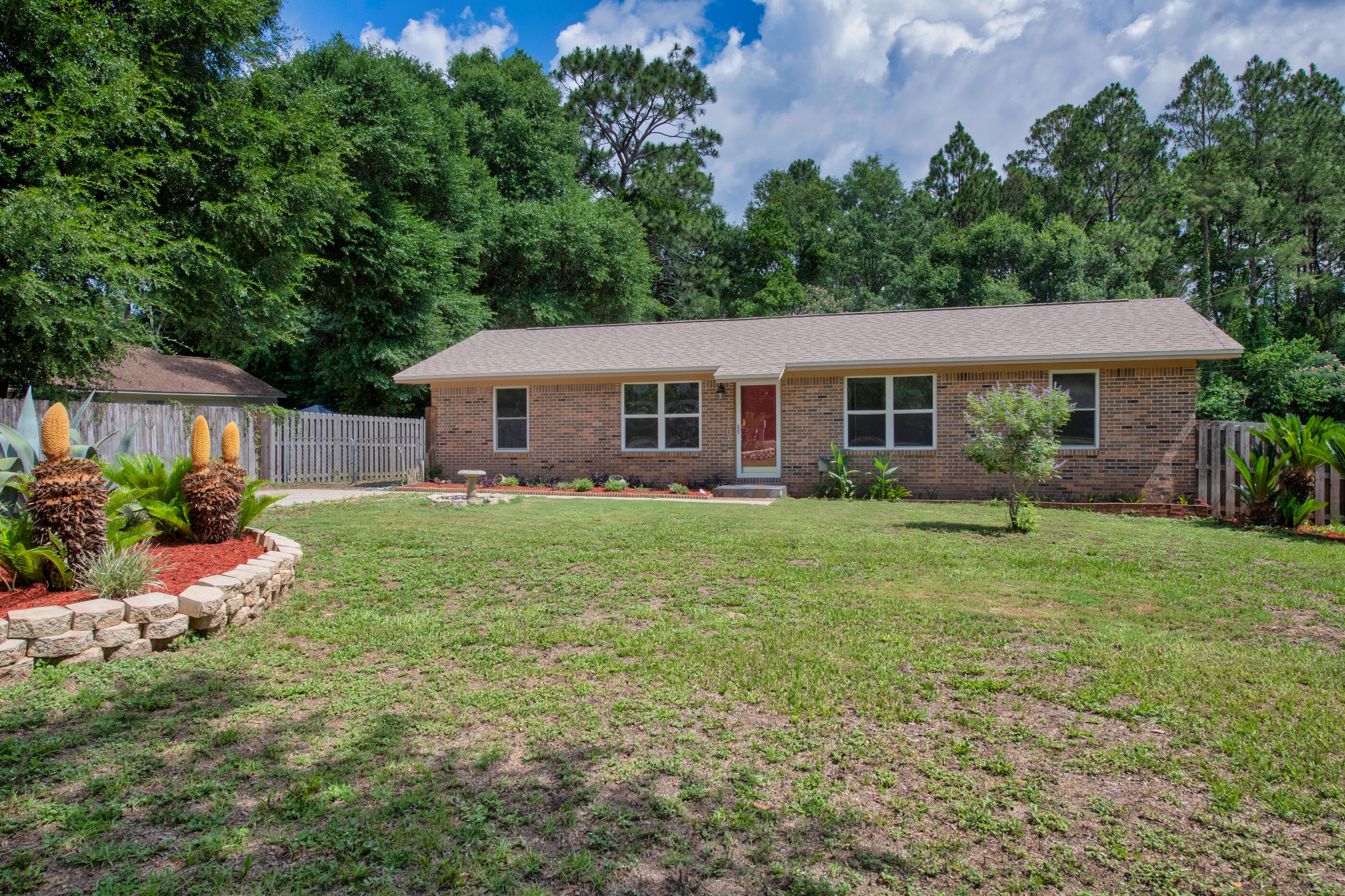front view of a house with a yard