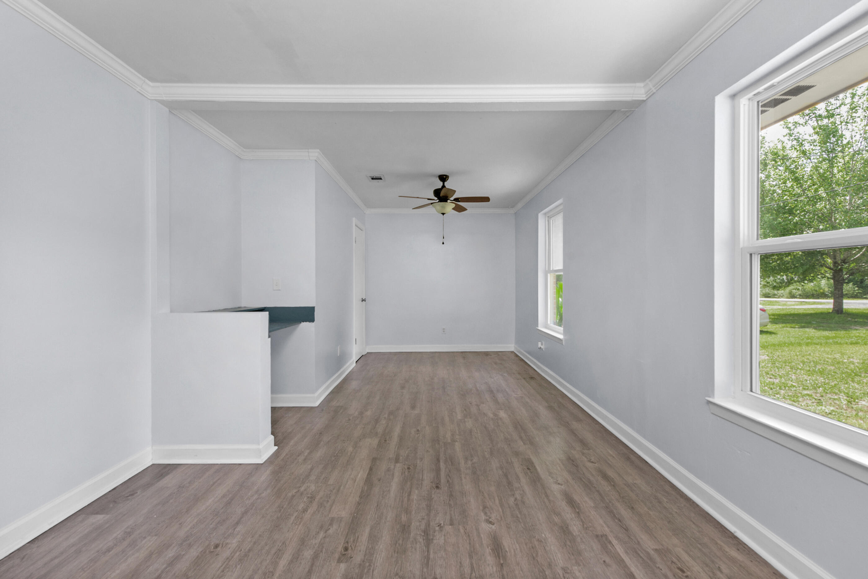 2909 Aplin Road Crestview, FL 32539 - Photo 16 of 29 wooden floor in an empty room with a window