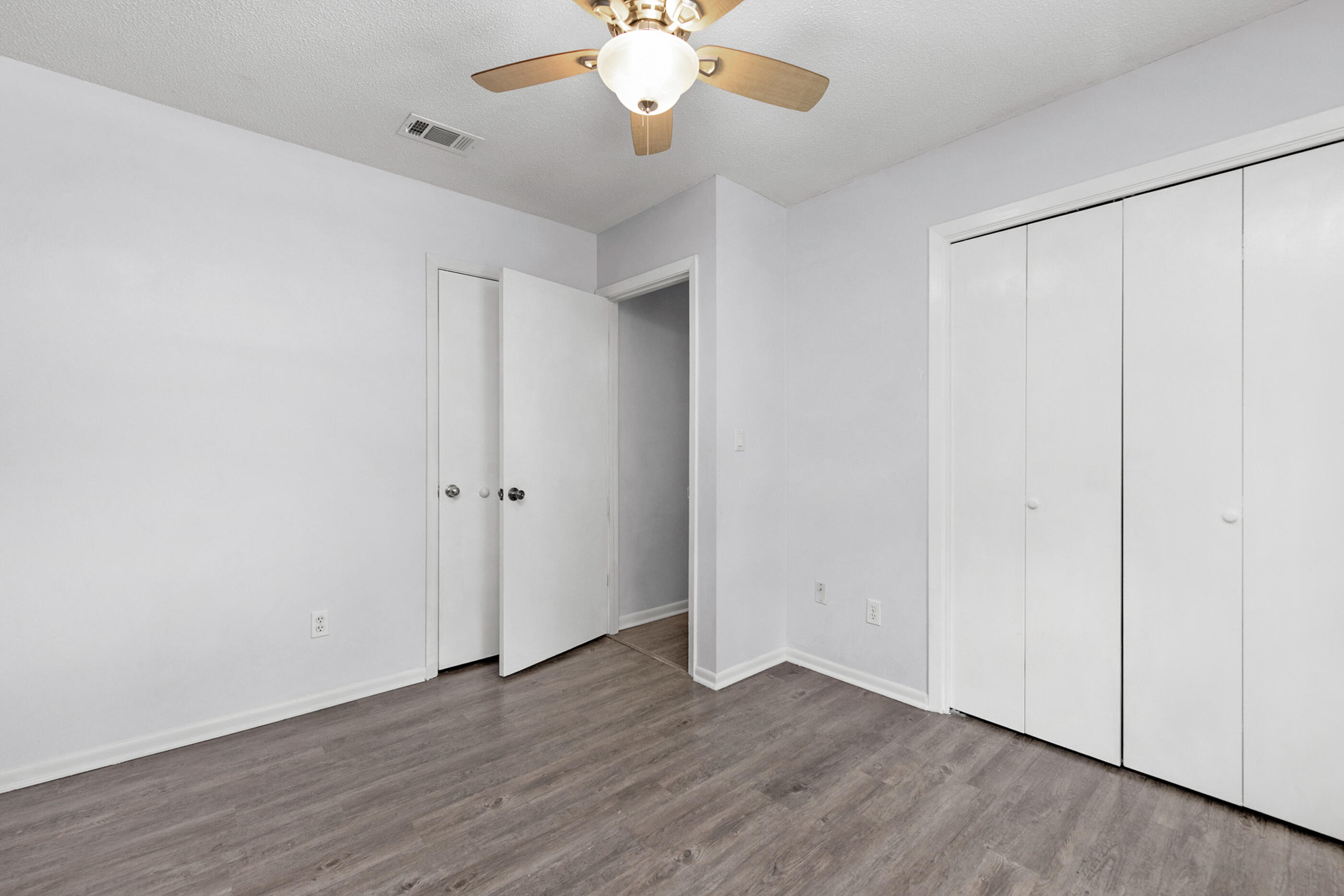 2909 Aplin Road Crestview, FL 32539 - Photo 22 of 29 a view of an empty room with wooden floor